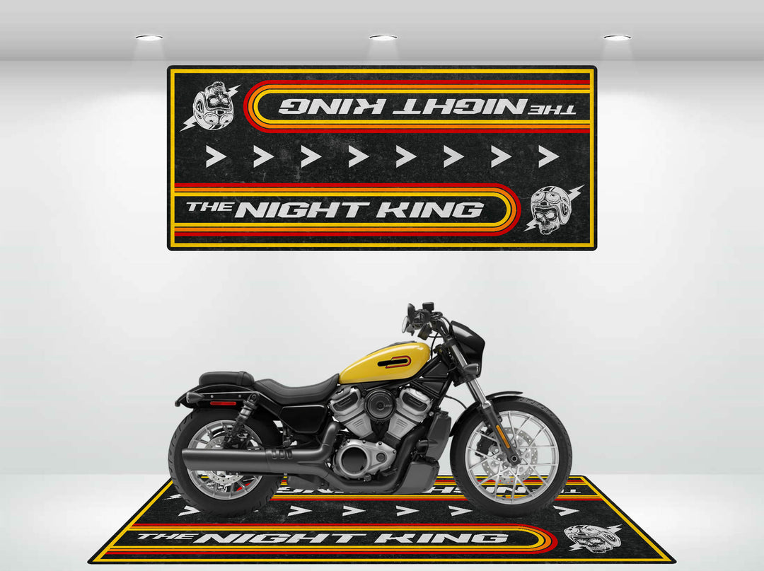A black and yellow motorcycle is showcased in a well-lit showroom with two matching Motorcycle Pit Mats, featuring the text The Nightster plus helmet and arrow graphics, enhancing a coordinated theme.