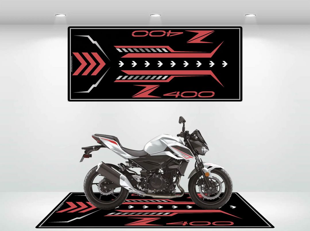Red and black custom motorcycle mat designed for Kawasaki Z400, shown with a matching white Z400 bike for garage or showroom display.