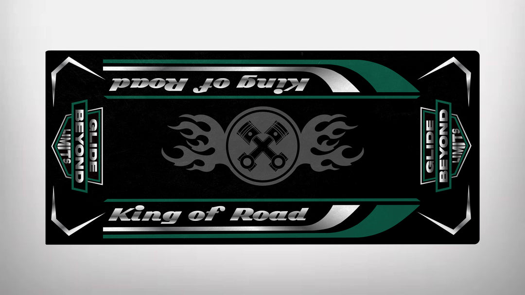 This Motorcycle Pit Mat boasts a sleek design with crossed wrenches and flame motifs, declaring King of Road and Glide Beyond Limits in bold green and silver on a durable black background.