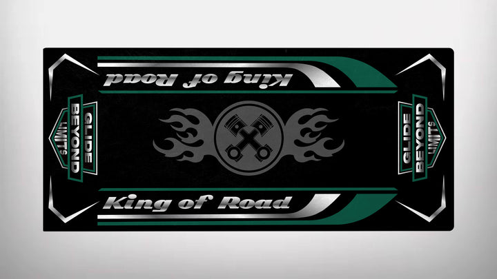 This Motorcycle Pit Mat boasts a sleek design with crossed wrenches and flame motifs, declaring King of Road and Glide Beyond Limits in bold green and silver on a durable black background.
