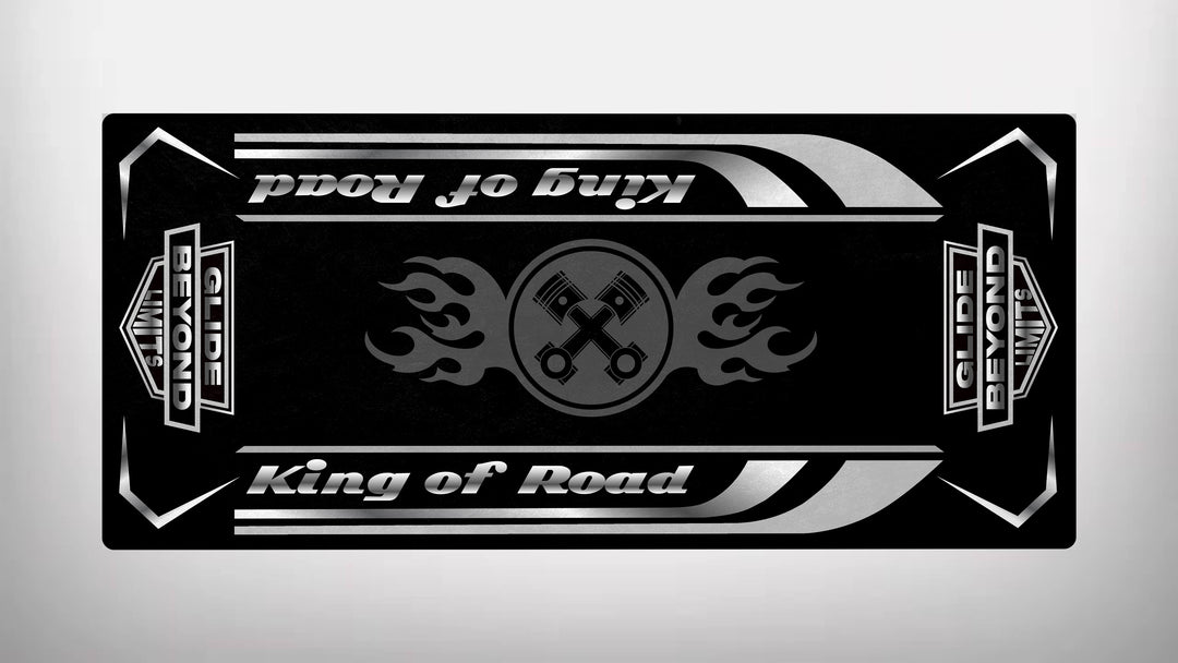 The sleek black and silver Motorcycle Pit Mat for King of Road features King of Road on the top and bottom. Crossed spanners with flame motifs spotlight durability, while bold rectangular borders display GLIDE BEYOND and BEYOND LIMITS on the sides.