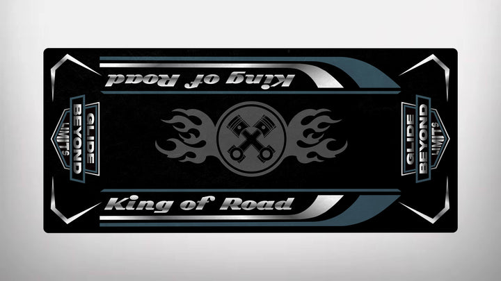 The Motorcycle Pit Mat, branded as Motorcycle Mat for King of Road, features a sleek design with flames and crossed wrenches on a black background. The text Glide Beyond Limits adorns corner rectangles, and white and blue stripes accent this Harley Davidson-inspired durable mat.